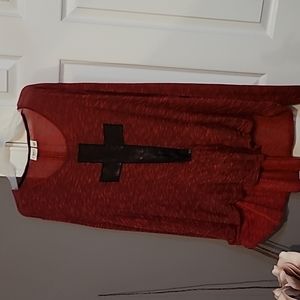 Light red sweater with cross
